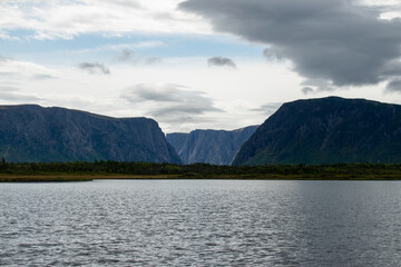 Aboard the ferry on Western Brook Pond, the breathtaking fjord and surrounding landscapes unfold,...