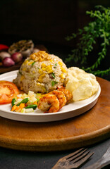 Seafood fried rice with prawn shrimp, omelette and garnish
