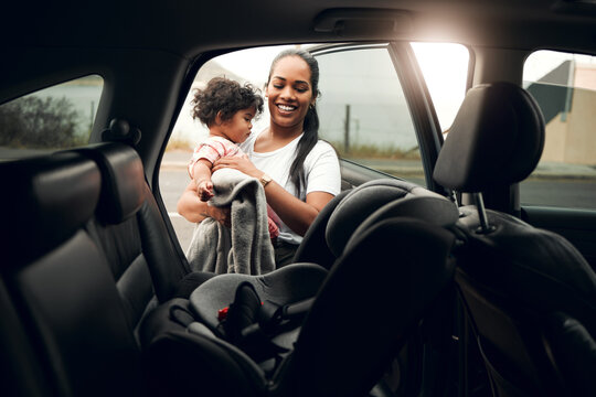 Happy mother, car and baby with seat for road trip, travel and vehicle safety in city. Mom, child or kid with harness, belt or protection in security for transportation, journey or adventure together