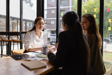 Asian businesswoman teamwork working on laptop with finances analysis report at desk in office, business financing, accounting banking, Team of creative and business planning, 