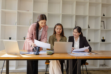 Asian businesswoman teamwork working on laptop with finances analysis report at desk in office, business financing, accounting banking, Team of creative and business planning, 