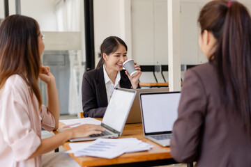 Asian businesswoman teamwork working on laptop with finances analysis report at desk in office, business financing, accounting banking, Team of creative and business planning, 