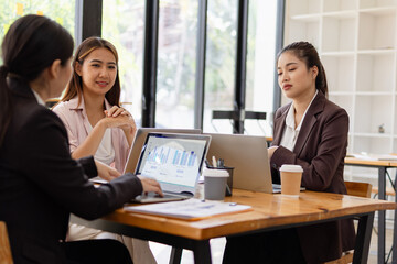 Asian businesswoman teamwork working on laptop with finances analysis report at desk in office, business financing, accounting banking, Team of creative and business planning, 