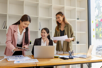 Asian businesswoman teamwork working on laptop with finances analysis report at desk in office, business financing, accounting banking, Team of creative and business planning, 