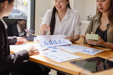 Asian businesswoman teamwork working on laptop with finances analysis report at desk in office, business financing, accounting banking, Team of creative and business planning, 