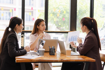 Asian businesswoman teamwork working on laptop with finances analysis report at desk in office, business financing, accounting banking, Team of creative and business planning, 
