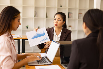 Asian businesswoman teamwork working on laptop with finances analysis report at desk in office, business financing, accounting banking, Team of creative and business planning, 