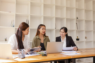 Asian businesswoman teamwork working on laptop with finances analysis report at desk in office, business financing, accounting banking, Team of creative and business planning, 