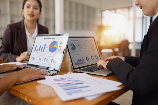 business people working together, financial advisory services concept. Business teamwork and working on digital laptop computer with advisor showing plan of investment to clients at table office,