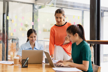 Excited Asian businesswoman team working together in office, About successful startup projects concept.