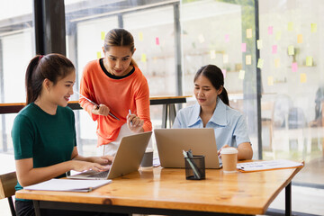 Technology and financial advisory services concept. Businesswoman teamwork and working on digital laptop computer with advisor showing plan of investment to clients at table office. Digital marketing.