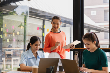 Technology and financial advisory services concept. Businesswoman teamwork and working on digital laptop computer with advisor showing plan of investment to clients at table office. Digital marketing.