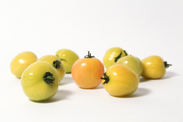 Little green tomatoes on isolated white background