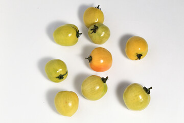 Little green tomatoes on isolated white background