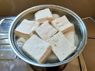 Fresh Tofu Blocks in a Pot of Water for Cooking Preparation