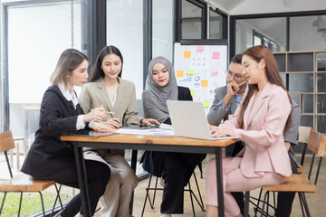 Team of Asian business people and working together in office, Startup projects and business presentation at meeting room.