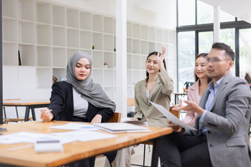Team of Asian business people and working together in office, Startup projects and business presentation at meeting room.