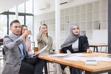 Team of Asian business people and working together in office, Startup projects and business presentation at meeting room.