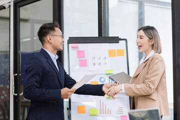 Team of Asian business people and working together in office, Startup projects and business presentation at meeting room.