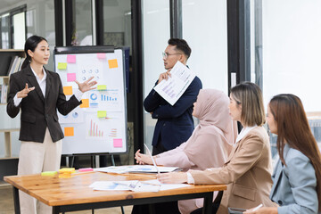 Team of Asian business people and working together in office, Startup projects and business presentation at meeting room.