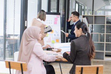 Team of Asian business people and working together in office, Startup projects and business presentation at meeting room.