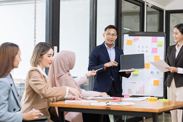 Team of Asian business people and working together in office, Startup projects and business presentation at meeting room.