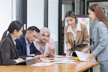 Team of Asian business people and working together in office, Startup projects and business presentation at meeting room, Brainstorming and business,