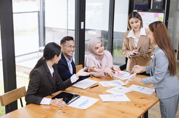 Team of Asian business people and business presentation at meeting room, Brainstorming and business,