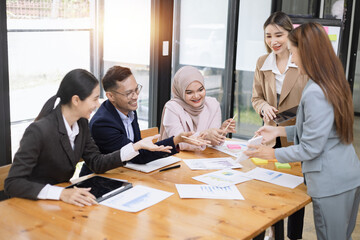 Team of Asian business people and business presentation at meeting room, Brainstorming and business,