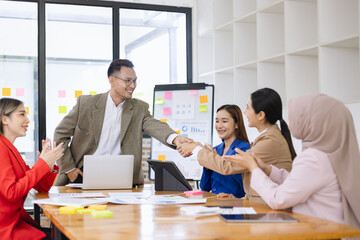 Fototapeta premium Team of asian business working with finances analysis report meeting in office, business financing, accounting banking, Business teamwork, Team of creative asian business meeting and business planning