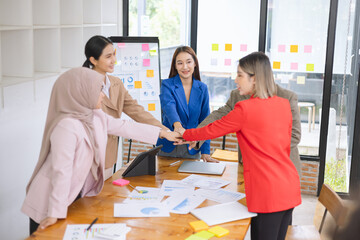 Asian business teamwork making handshake with partner in meeting room, Greeting and corporate business handshake, 