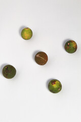 Green lime fruits on isolated white background. Sliced and unsliced.