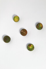 Green lime fruits on isolated white background. Sliced and unsliced.