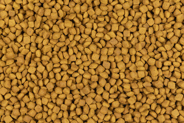 dry pet food background texture. close up. top view
