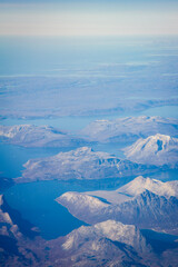 Greenlandic ice cap with frozen mountains and fjord aerial view