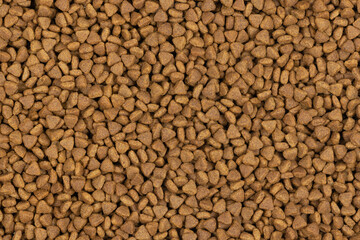 dry pet food background texture. close up. top view