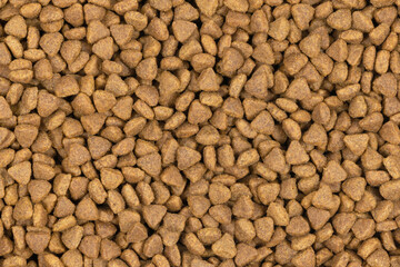 dry pet food background texture. close up. top view