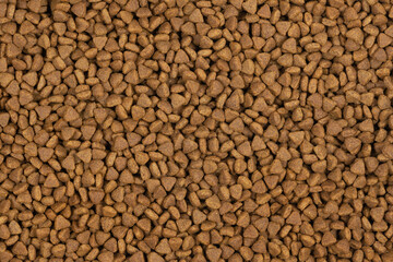 dry pet food background texture. close up. top view