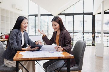 Two businesswoman working with analysis data investment plan, Business startup and marketing...