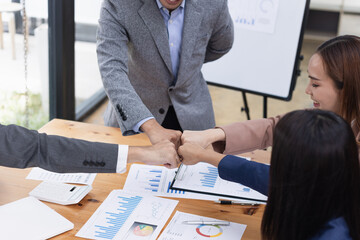 Asian business teamwork working with analysis report and advisor showing plan, Financial analysis and Marketing teamwork concept.