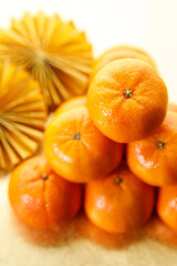 Tangerine oranges on golden background for celebration Lunar New Year
