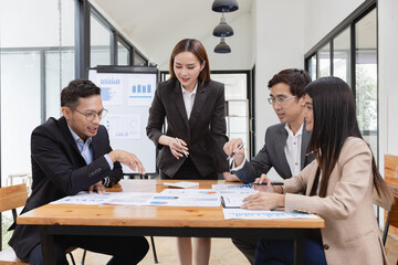 Asian business teamwork working with analysis report and advisor showing plan, Financial analysis and Marketing teamwork concept.