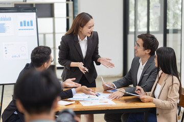 Asian business teamwork working with analysis report and advisor showing plan, Financial analysis and Marketing teamwork concept.