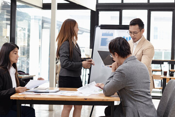 Asian business teamwork working with analysis report and advisor showing plan, Financial analysis and Marketing teamwork concept.