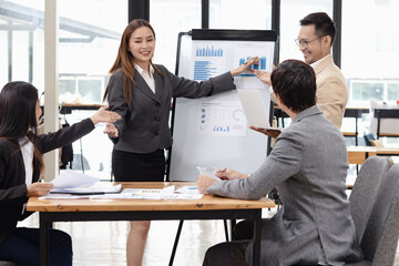 Asian business teamwork working with analysis report and advisor showing plan, Financial analysis and Marketing teamwork concept.
