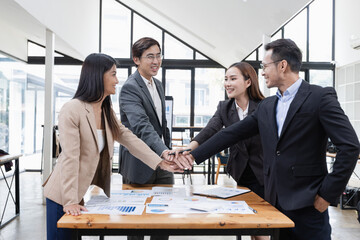 Asian business teamwork working with analysis report and advisor showing plan, Financial analysis and Marketing teamwork concept.