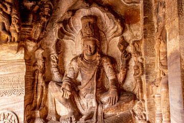 Ancient Sculpture of Lord Vishnu seated on Ananta at Badami cave