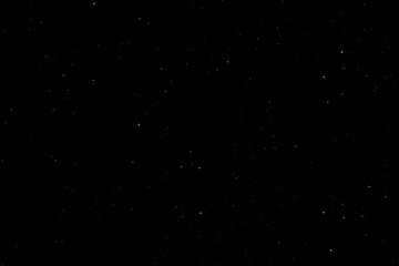 Chaotic white star bokeh on black background. falling blurry bokeh snow overlay, starry sky. white spot and drops. abstraction