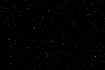 Chaotic white star bokeh on black background. falling blurry bokeh snow overlay, starry sky. white spot and drops. abstraction