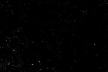 Chaotic white star bokeh on black background. falling blurry bokeh snow overlay, starry sky. white spot and drops. abstraction